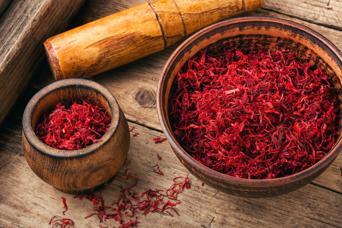 pngtree-raw-organic-red-saffron-spice-on-wooden-background-dried-saffron-spice-picture-image_2323078